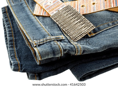 blue denim jeans and strap leather belt on white background