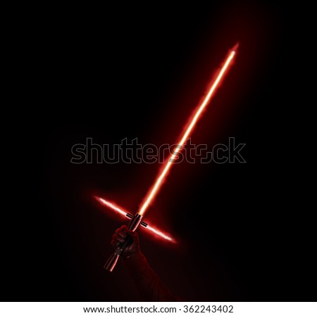 New red light saber holdng in hand isolated on black. Lightsaber futuristic weapon. Sabre sword with fire force. Beam weapon equipment. Laser steel swords. Dark and light force.
