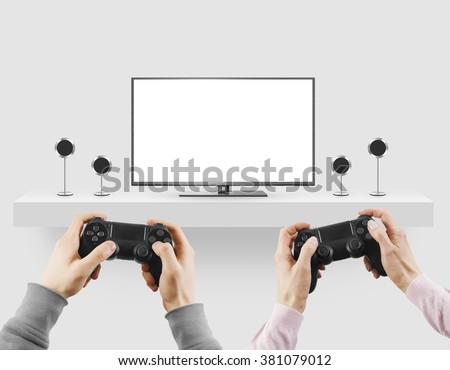Man hold gamepad in hands in front of blank tv screen mock up playing game. Clear monitor mockup with gamer first person. Men play video games on console station. People gaming contest. Two players.
