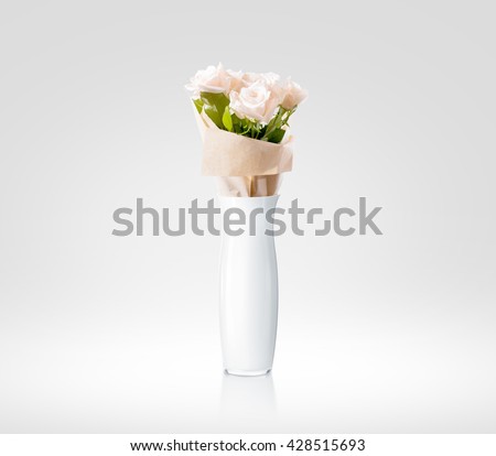 Blank white vase with flowers bouquet design mockup. Clear water glass mock up template stand with roses. Plain vase shape surface ready for your pattern presentation isolated.