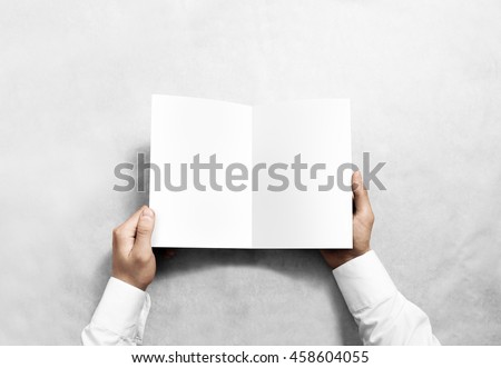 Hand opening blank white brochure booklet mockup. Leaflet presentation. Pamphlet mock up holding hand. Man show clear offset paper. Booklet design template. A5 paper sheet display read first person