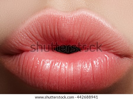 Sweet kiss. Perfect natural lip makeup. Close up macro photo with beautiful female mouth. Plump full lips. Close-up face detail. Perfect clean skin, light fresh lip make-up. Beautiful spa tender lip.