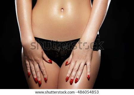 Waxing for beautiful woman. Brazilian laser hair removal bikini line an sexy body shapes. Close-up of sexy female wearing black lace panties. Body care and clean skin