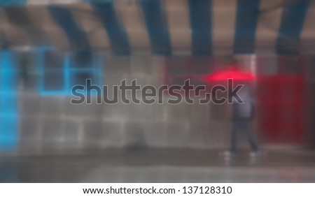 a girl walks in the rain, photo through the curtain