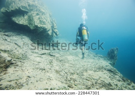 Scuba diving climb the mountain under the hot spring, hot water make vision blurry in Coron area, Palawan, Philippines.