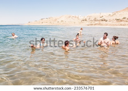 DEAD SEA, JORDAN - SEP 16:People floating on SEPTEMBER 16 2013.The Dead Sea is second saltiest body of water in the world, with a salt content of 33% that creates a natural buoyancy.