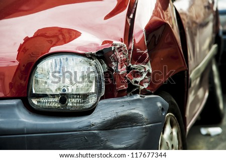stock-photo-details-of-a-red-car-in-an-accident-117677344.jpg