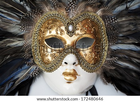 Colorful venetian mask with many details on it
