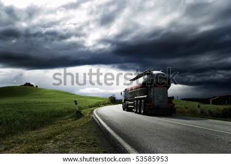 A white truck run on a road