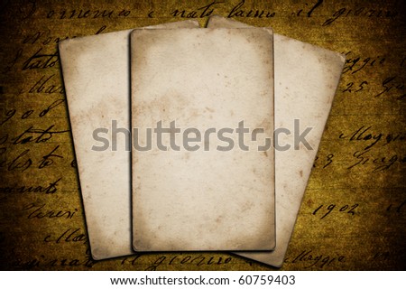 Three grunge papers on a grunge background
