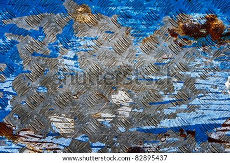 Background of old metal diamond plate in blue color