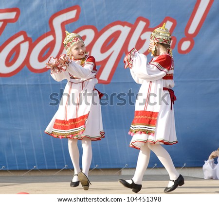 PODOLSK, RUSSIA - MAY 9: Unidentified artists of ensemble of culture dance Voronegh dancing at event dedicated to Victory Day in WWII on May 9, 2012 in Podolsk, Russia