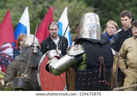 MOSCOW - SEPTEMBER 1: Unidentified people in knight costume fights on event of Moscow city day in Luzhniki scene on September 1, 2012 in Moscow, Russia