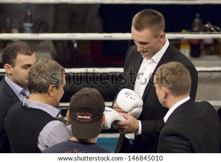MOSCOW - SEPTEMBER 21: A. Gridin gives autograph just before Osminog International clubs tournament  on September 21, 2012. Moscow, Russia