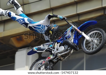 MOSCOW - JULY 13: Anton Smirnov jump on city event Sport of Moscow passing in Luzhniki, Motofreestile FMX place, on July 13, 2013, in Moscow, Russia