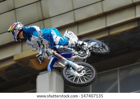 MOSCOW - JULY 13: Alexey Kolesnikov jump on city event Sport of Moscow passing in Luzhniki, Motofreestile FMX place, on July 13, 2013, in Moscow, Russia