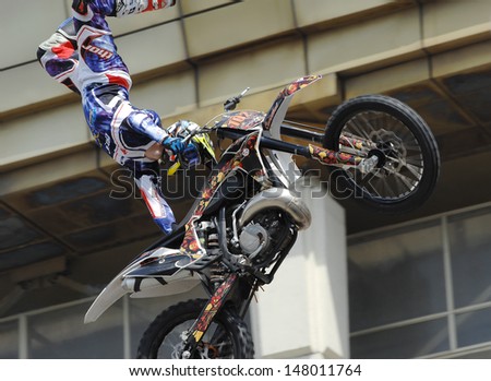 MOSCOW - JULY 13: Alexey Aisin on city event Sport of Moscow passing in Luzhniki, Motofreestile FMX place, on July 13, 2013, in Moscow, Russia