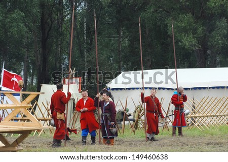 RUSSIA, MOLODI VILLAGE - JULY 27: Unidentified people in retro costume on event dedicated to Victory in battle near the Molodi village 1572, on July 27, 2013, in Moscow region, Russia