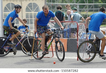 MOSCOW - JULY 13: Unidentified people play bicycle polo on city event Sport of Moscow passing in Luzhniki, on July 13, 2013, in Moscow, Russia