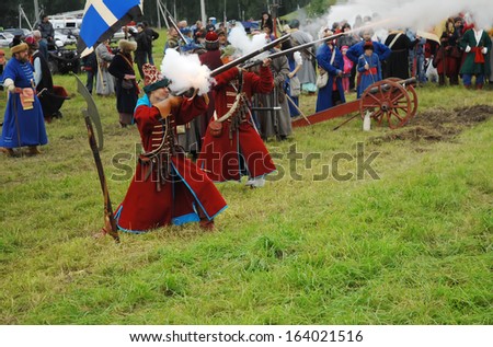 RUSSIA, MOLODI VILLAGE - JULY 27: Unidentified people shooting by rifle on event dedicated to Victory in battle near the Molodi village 1572, on July 27, 2013, in Moscow region, Russia