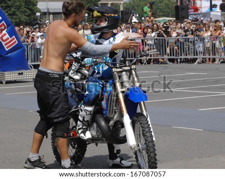 MOSCOW - JULY 13: Anton Smirnov and Anton Volkov on city event Sport of Moscow passing in Luzhniki, Motofreestile FMX place, on July 13, 2013, in Moscow, Russia