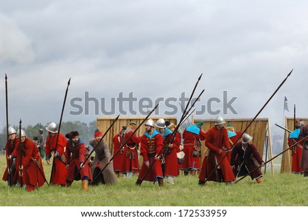RUSSIA, MOLODI VILLAGE - JULY 27: Unidentified people in defends by spears on event dedicated to Victory in battle near the Molodi village 1572, on July 27, 2013, in Moscow region, Russia