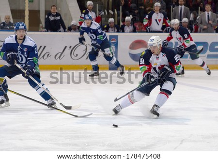 MOSCOW - JANUARY 28, 2014: Libor Hudacek (90) in action  during the KHL hockey match Dynamo Moscow vs Slovan Bratislava in sport palace Luzhniki in Moscow, Russia. Final score 2:3