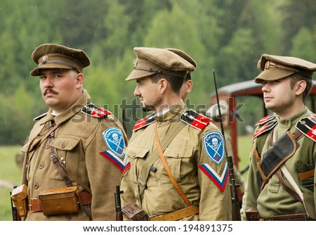 RUSSIA, CHERNOGOLOVKA - MAY 17: Unidentified men of Kornilov squad on History reenactment of battle of Civil War in 1914-1919 on May 17, 2014, Chernogolovka city, Ivanovskoe village, Russia