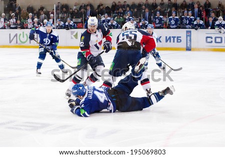 MOSCOW - JANUARY 28, 2014: Janne Jalasvaara (46) fall down during the KHL hockey match Dynamo Moscow vs Slovan Bratislava in sport palace Luzhniki in Moscow, Russia. Final score 2:3