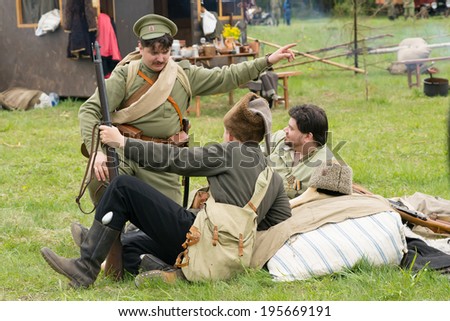 CHERNOGOLOVKA, RUSSIA - MAY 17: Unidentified soldiers resting on History reenactment of battle of Civil War in 1914-1919 on May 17, 2014, Chernogolovka city, Ivanovskoe village, Russia