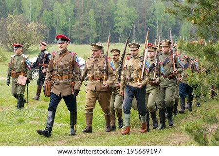 CHERNOGOLOVKA, RUSSIA - MAY 17: Unidentified military Kornilovs squad walk on History reenactment of battle of Civil War in 1914-1919 on May 17, 2014, Chernogolovka city, Ivanovskoe village, Russia