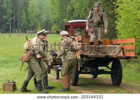 RUSSIA, CHERNOGOLOVKA - MAY 17: Unidentified soldiers load the Maxim machine gun on truck on History reenactment of battle of Civil War in 1914-1919 on May 17, 2014, Russia