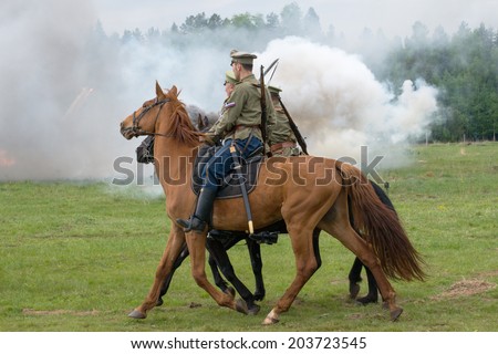 RUSSIA, CHERNOGOLOVKA - MAY 17: Cavalry soldiers ride on History reenactment of battle of Civil War in 1914-1919 on May 17, 2014, Russia