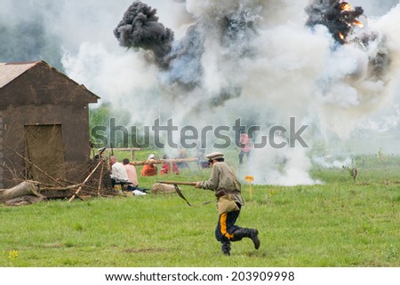 RUSSIA, CHERNOGOLOVKA - MAY 17: Unidentified soldier run through the village on History reenactment of battle of Civil War in 1914-1919 on May 17, 2014, Russia