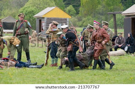 RUSSIA, CHERNOGOLOVKA - MAY 17: Unidentified soldier move a dead soldier on History reenactment of battle of Civil War in 1914-1919 on May 17, 2014, Russia