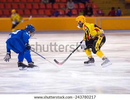 MOSCOW - DECEMBER 12, 2014: Ivanov N. (44) vs Potemin D. (61) during the Russian  bandy league game Dynamo Moscow vs SKA Neftyanik in sport palace Krilatskoe, Moscow, Russia. Dynamo won 9:1