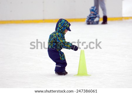 MOSCOW - JANUARY 25: Unidentified baby touch the cone on tournament on family sport event on January 25, 2015 in Moscow, Russia