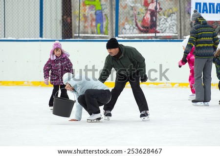 MOSCOW - JANUARY 25: Unidentified people trying to stand up after fall on family sport event on January 25, 2015 in Moscow, Russia