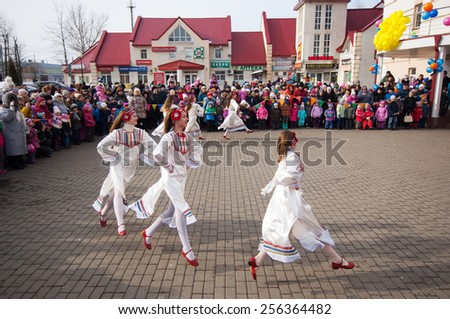 MOSCOW, RUSSIA - FEBRUARY 22: Unidentified girls dance on square on Russian religious and folk holiday Maslenitsa near Culture center Peresvet on February 22, 2015, Russia