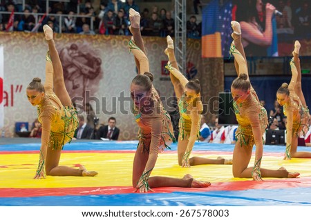 RUSSIA, MOSCOW - MARCH 27, 2015: Unidentified sportsmen of Russian national gymnastics aesthetic team dance on World Sambo Championship Kharlampiev memorial in Luzhniki sport palace, Moscow, Russia, 2015