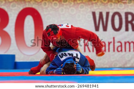 RUSSIA, MOSCOW - MARCH 27: Kanzhanov B. (Red) vs Umbayev N. (Blue) on World Sambo Championship Kharlampiev memorial in Luzhniki sport palace, Moscow, Russia, 2015