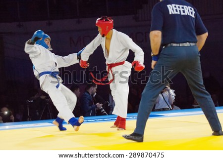 RUSSIA, MOSCOW - APRIL 18 2015: Tursunov S. (Red) vs Sagyn K. (Blue) on World Hand to hand combat Championship in Moscow, Russia, 2015