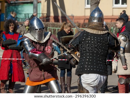 RUSSIA, MOSCOW - MARCH 14: Unidentified knights fights by the axes on tournament on history reenactment of the Medieval maneuvers in Moscow, 14 March, 2015, Russia