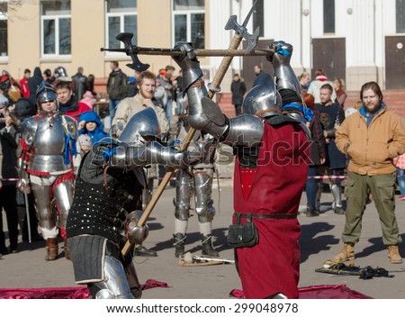 RUSSIA, MOSCOW - MARCH 14: Unidentified knights fights by the axes on  tournament on history reenactment of the Medieval maneuvers in Moscow, 14 March, 2015, Russia