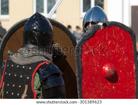 RUSSIA, MOSCOW - MARCH 14: Unidentified knights under shields protection on  tournament on history reenactment of the Medieval maneuvers in Moscow, 14 March, 2015, Russia