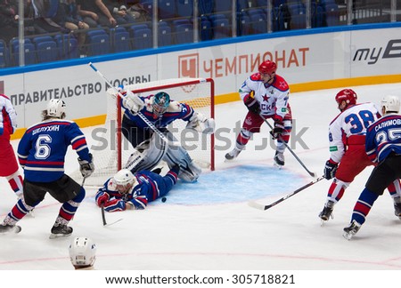 RUSSIA, MOSCOW - APRIL 27, 2015: A. Ledovskih (27) fall into the gate on hockey game CSKA vs SKA teams on Hockey Cup of Legends in Ice Palace VTB, Moscow, Russia