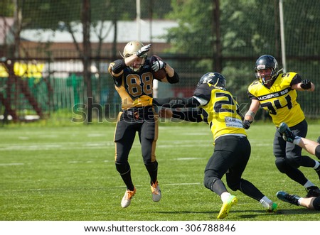 RUSSIA, TROITSK CITY - JULY 11: A. Kozlov (88) run with ball on Russian american football Championship game Spartans vs Raiders 52 on July 11, 2015, in Moscow region, Troitsk city, Russia