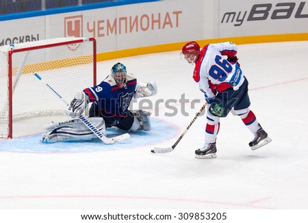 RUSSIA, MOSCOW - APRIL 27, 2015: Albert Leschev (96) attack on hockey game CSKA vs SKA teams on Hockey Cup of Legends in Ice Palace VTB, Moscow, Russia