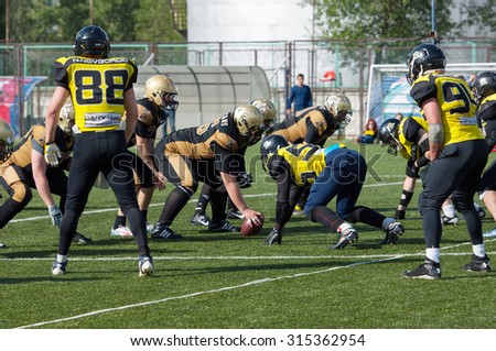 RUSSIA, TROITSK CITY - JULY 11: Unidentified Spartans players in action on American football Championship game Spartans vs Raiders 52 on July 11, 2015, in Moscow region, Troitsk city, Russia