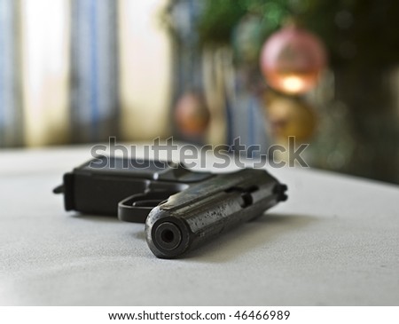 A pistol on a celebratory table. When celebrating is tightened too long....